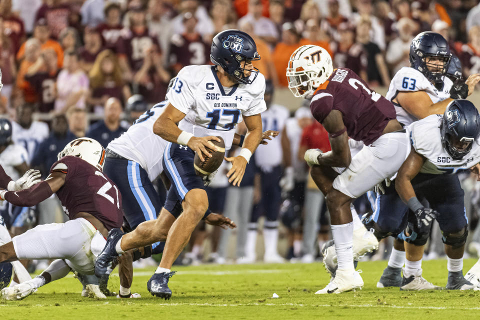 Old Dominion quarterback Grant Wilson scrambles for a first down against Virginia Tech during the first half of an NCAA college football Saturday, Sept. 2, 2023, in Blacksburg, Va. (AP Photo/Robert Simmons)