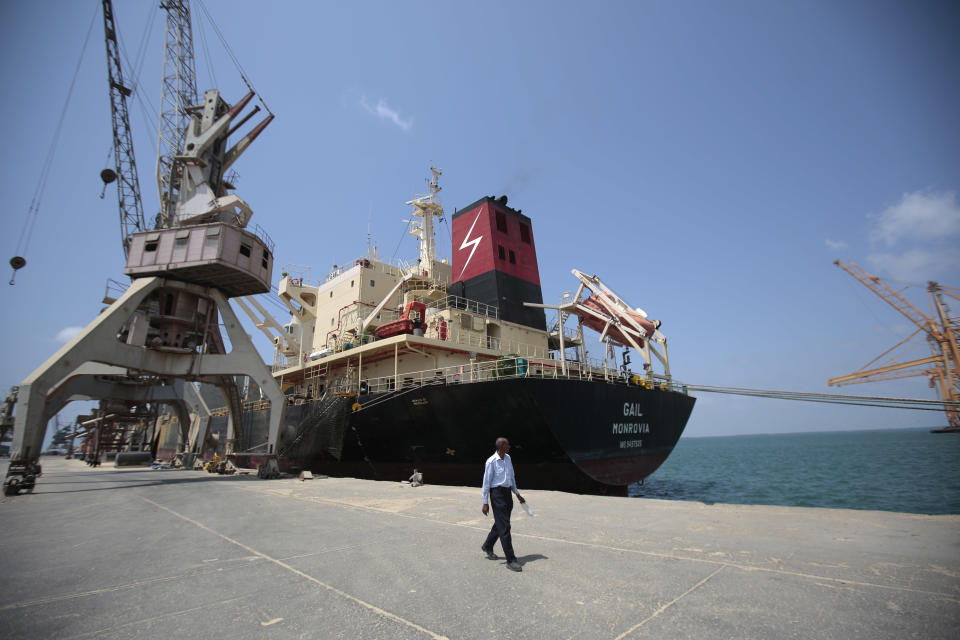 In this Saturday, Sept. 29, 2018 photo, a cargo ship is docked at the port, in Hodeida, Yemen. With US backing, the United Arab Emirates and its Yemeni allies have restarted their all-out assault on Yemen’s port city of Hodeida, aiming to wrest it from rebel hands. Victory here could be a turning point in the 3-year-old civil war, but it could also push the country into outright famine. Already, the fighting has been a catastrophe for civilians on the Red Sea coast. (AP Photo/Hani Mohammed)