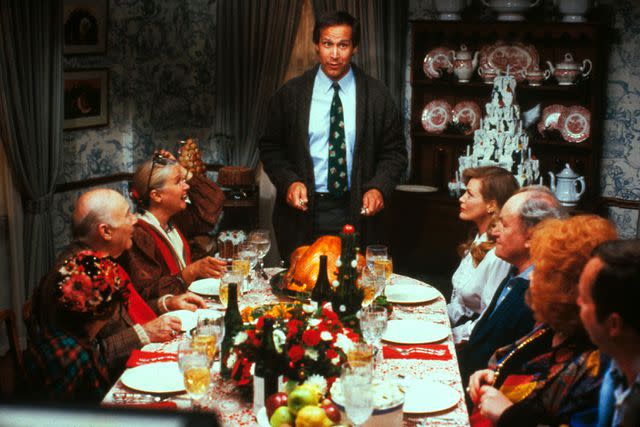<p>Warner Bros/Kobal/Shutterstock</p> Chevy Chase (center) in <em>National Lampoon's Christmas Vacation</em> (1989)