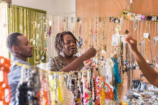 Yaisah Val and husband Richecarde Val shop for jewelry in Haiti, where the couple fights tirelessly to help their fellow Haitians understand gender identity