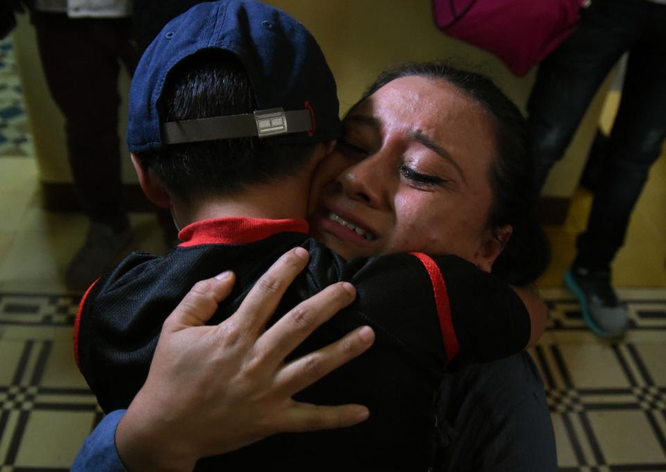 Lourdes de Leon hugs her son Leo, who was separated from her at the U.S. border, at a shelter in Guatemala City on Aug. 7, 2018.