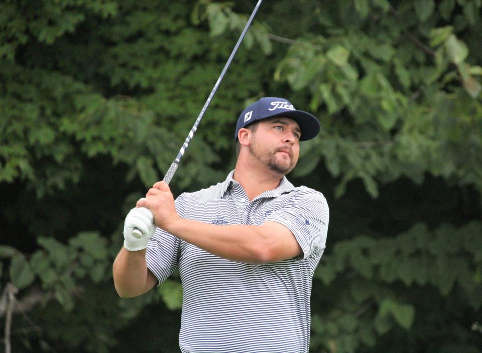 Brett White follows a tee shot during the first round of Boyne Mountain's Tournament of Champions Monday. White shared the lead with Bradley Smithson with a round of 65.