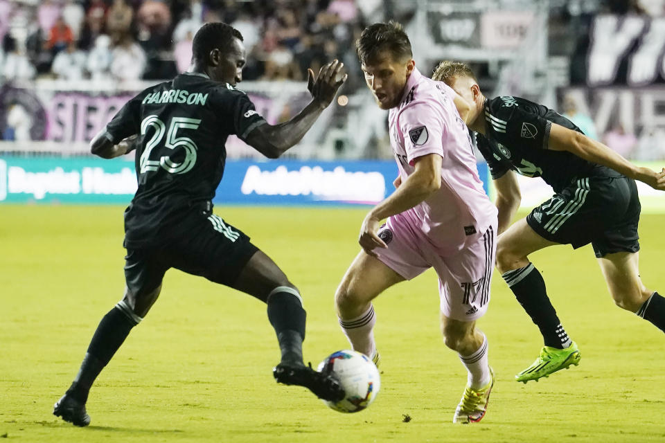 Charlotte FC defender Harrison Afful (25) blocks a pass by Inter Miami midfielder Indiana Vassilev (17) during the first half of an MLS soccer match Saturday, July 16, 2022, in Fort Lauderdale, Fla. (AP Photo/Marta Lavandier)