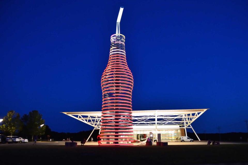 route 66 through Arcadia, Oklahoma, and you cant miss the neon, 66-foot-tall soda bottle in front of POPS