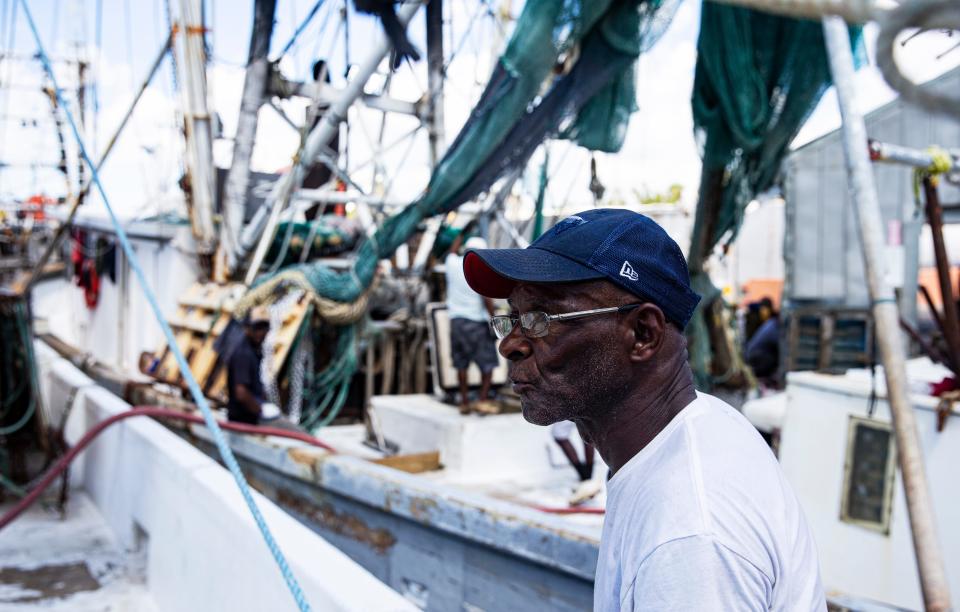 Logan Lyons, a shrimp captain for Erickson & Jensen on San Carlos Island on Fort Myers Beach waits as the boat he captains is filled with fuel on Thursday, Sept. 14, 2023. He says it has been really hard since Hurricane Ian slammed ashore last year. He says the shrimping is great but he is struggling because of low shrimp prices and high fuel prices. He says they are sinking and taking on water, yet he persists.