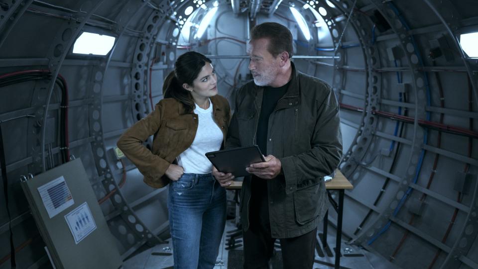 Fubar. (L to R) Monica Barbaro as Emma Brunner, Arnold Schwarzenegger as Luke Brunner in episode 103 of Fubar. Cr. Christos Kalohoridis/Netflix © 2023