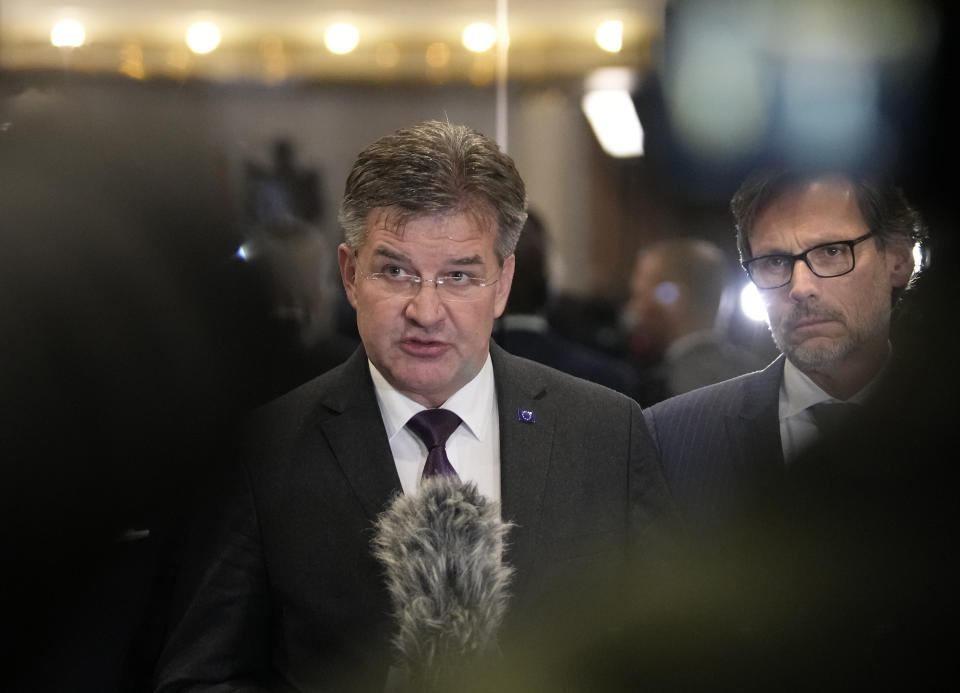 European Union envoy Miroslav Lajcak, left, addresses to the media with Jens Plettner, advisor of German Chancellor Olaf Scholz, right, after meeting with Serbian President Aleksandar Vucic, in Belgrade, Serbia, Friday, Jan. 20, 2023. Western envoys on Friday were visiting Kosovo and Serbia as part of their ongoing efforts to defuse tensions and help secure a reconciliation agreement between the two. (AP Photo/Darko Vojinovic)