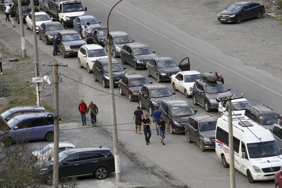 Cars queuing toward the border crossing at Verkhny Lars between Russia and Georgia, leaving Chmi, North Ossetia - Alania Republic, in Russia, Thursday, Sept. 29, 2022. Long lines of vehicles have formed at a border crossing between Russia's North Ossetia region and Georgia after Moscow announced a partial military mobilization to bolster its troops in Ukraine, many Russians are leaving their homes. (AP Photo)