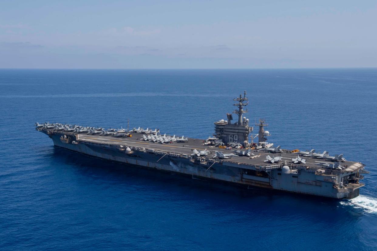 A US Navy aircraft carrier is rearmed and back in the Red Sea amid a ...