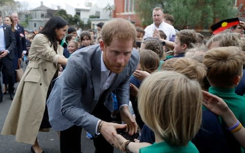 Prince Harry and Meghan meet children at Albert Park Primary School - Credit: AP