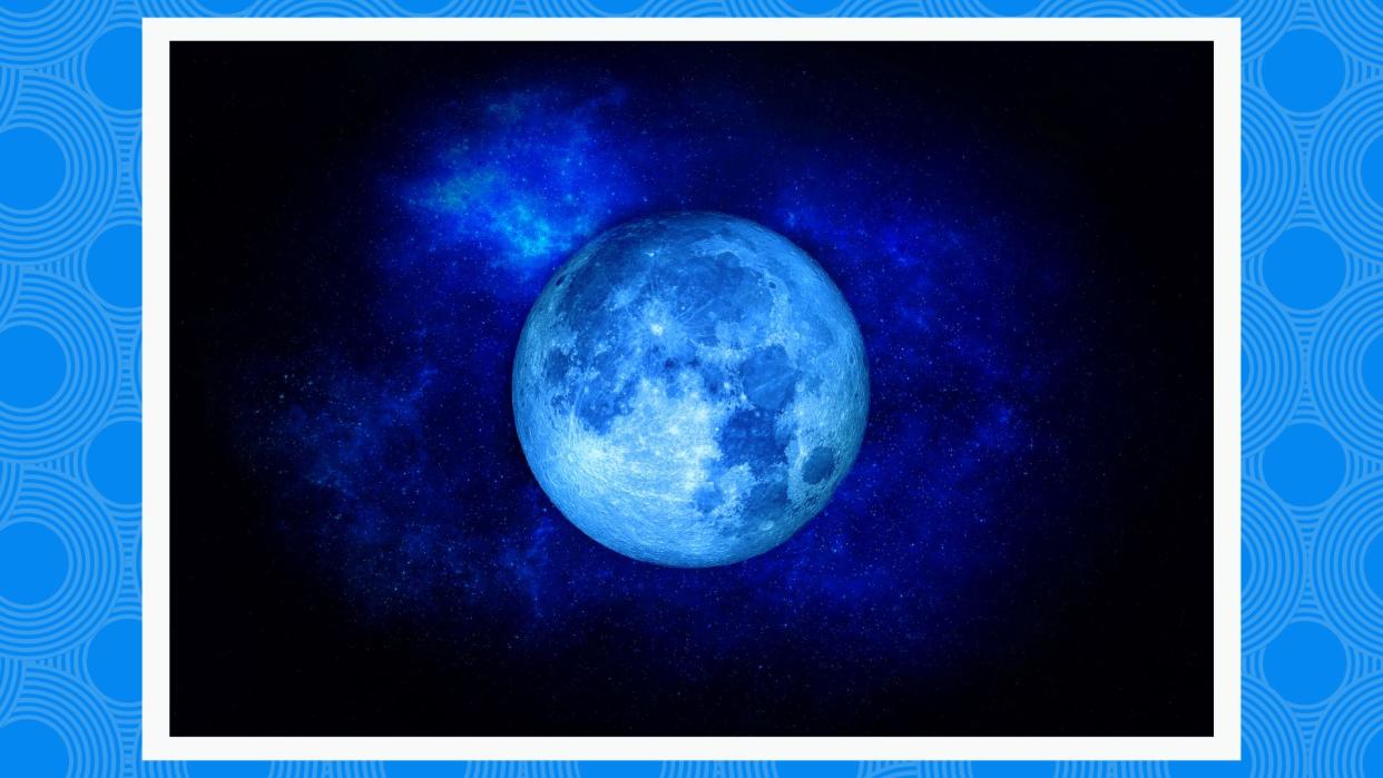  Blue moon on a black sky background 