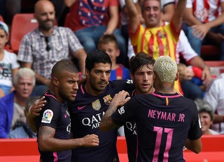 Football Soccer - Sporting Gijon v Barcelona - Spanish La Liga Santander - El Molinon stadium, Gijon, Spain- 24/09/16. Barcelona's Luis Suarez (2nd L) celebrates his goal with teammates. REUTERS/Eloy Alonso