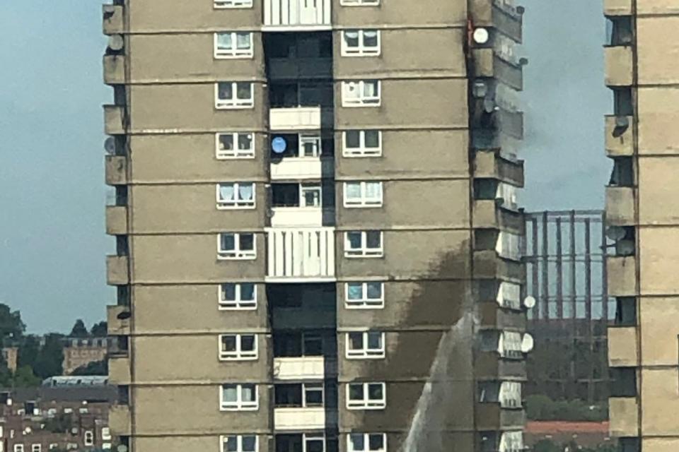 Smoke was seen pouring from the tower block on Darfield Way, W10 (Danielle Bond)