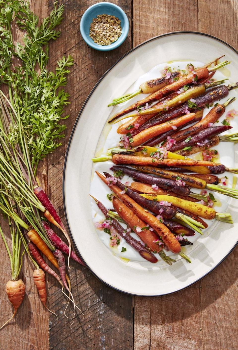 <p>Coriander, mint, and vinegar turn basic carrots into a complex side dish.</p><p><strong><a href="https://www.countryliving.com/food-drinks/a28609650/coriander-roasted-carrots-recipe/" rel="nofollow noopener" target="_blank" data-ylk="slk:Get the recipe for Coriander-Roasted Carrots;elm:context_link;itc:0;sec:content-canvas" class="link ">Get the recipe for Coriander-Roasted Carrots</a>.</strong> </p>