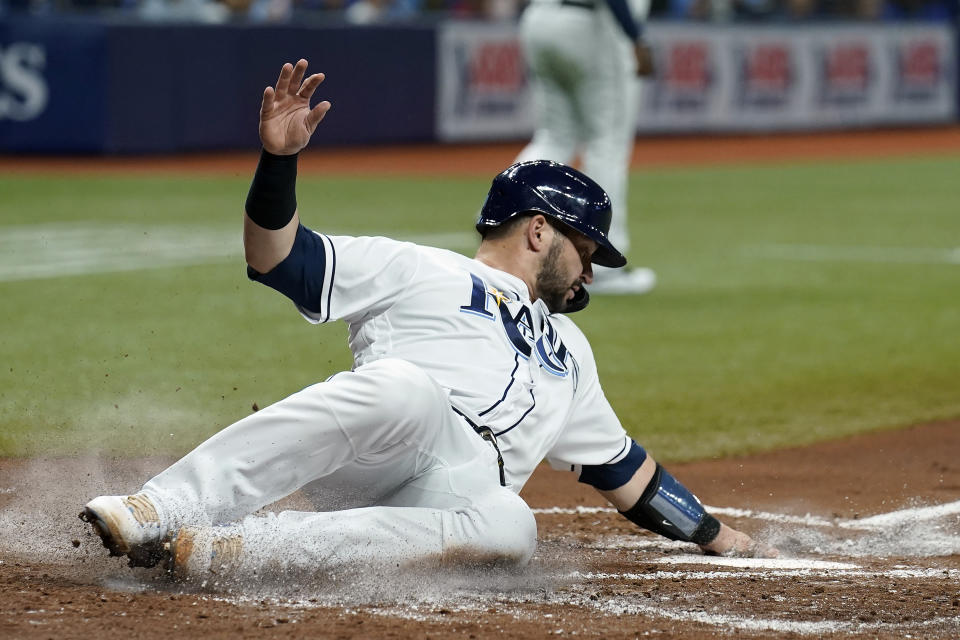Tampa Bay Rays' Mike Zunino scores on an RBI single by Brandon Lowe off Toronto Blue Jays starting pitcher Alek Manoah during the second inning of a baseball game Tuesday, Sept. 21, 2021, in St. Petersburg, Fla. (AP Photo/Chris O'Meara)