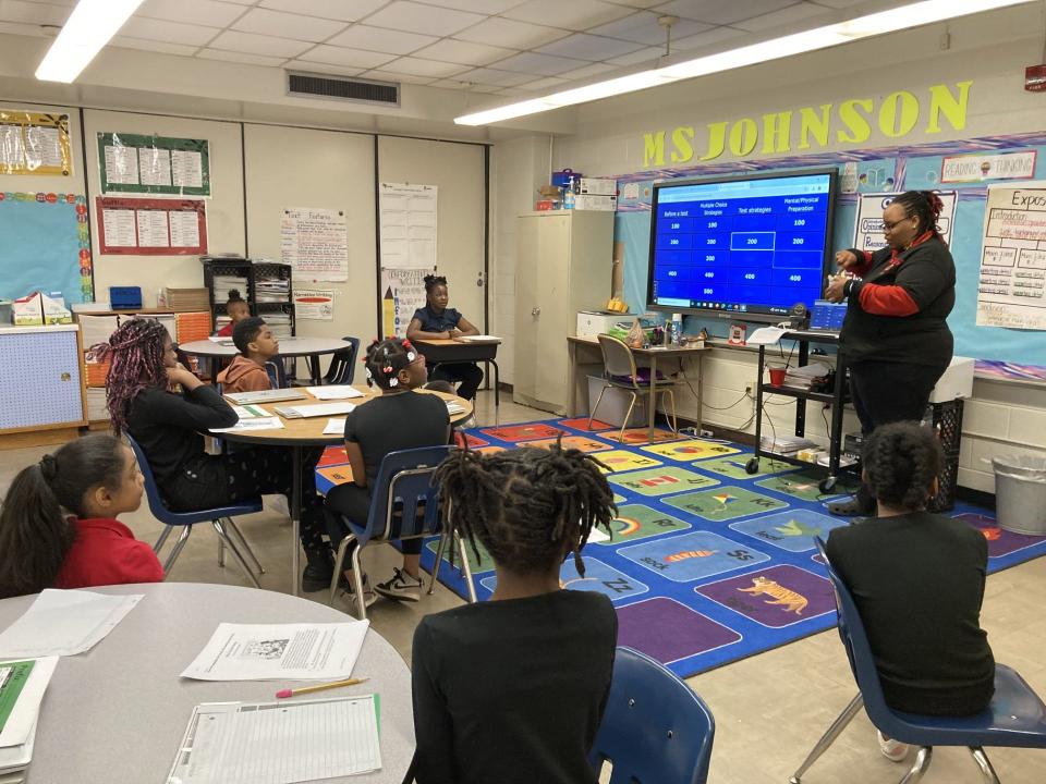 Amanda Johnson, an ELA teacher at Hawkins Mills Elementary, leads "TCAP" jeopardy in her classroom.