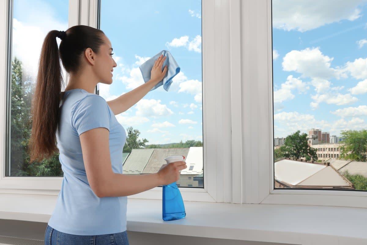 Woman cleaning windows