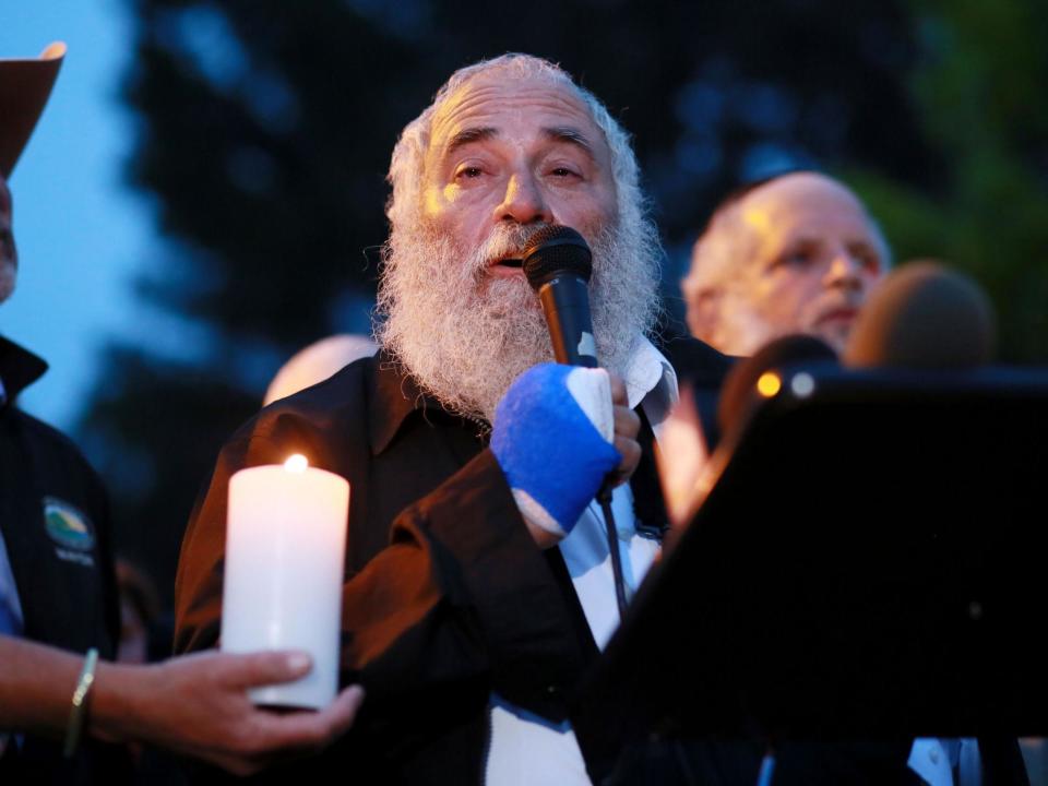 Rabbi Yisroel Goldstein was walking into the banquet hall at Chabad of Poway on Saturday when he heard a loud noise.He thought a table had toppled or that one of his congregants had fallen.“I did not know what that was,” he said. But when he turned around, he immediately found out.“I was face to face with this murder terrorist who was holding the rifle and looking straight at me,” he said.The gunman did not say anything.“As soon as he saw me, he started to shoot towards me and that is when I put my hands up,” Rabbi Goldstein said.In an interview on America's Today show on Sunday, Rabbi Goldstein recounted the harrowing moments when the gunman entered the synagogue in Poway, California, and opened fire with an AR-15-style gun.“My fingers got blown away,” Goldstein said. “I cannot erase that face from my mind.”The shooting at Chabad of Poway was the most recent in a string of deadly attacks at houses of worship, including a mass shooting at a mosque in New Zealand in March that was livestreamed on Facebook and fatal bombings at churches in Sri Lanka on Easter Sunday that killed more than 300 people.The attack at Chabad of Poway happened six months to the day after one of the deadliest attacks against the American Jewish community killed 11 in a Pittsburgh synagogue.The attack on Saturday left a 60-year-old woman dead, the rabbi wounded, and a 34-year-old man and a young girl with shrapnel wounds.The shooting occurred while there were 40 to 60 people at the synagogue and on Saturday, which was the Sabbath and also the last day of Passover, a holiday that celebrates Jewish freedom.Rabbi Goldstein and those injured were expected to recover, but he said he will be scarred for life.“I cannot erase the moment, and it is going to be embedded there forever,” he said.After the gunman, identified by officials as John T Earnest, 19, shot Goldstein in his hand, he shot to death a woman the rabbi had known for 33 years and who had helped him build the synagogue.Rabbi Goldstein said he immediately went into action.“I turned around and I saw a group of children in the banquet hall, including my granddaughter, and I just ran, not even knowing that my fingers were blown off and curled all the kids together and got them outside and went into the sanctuary and got everyone out of the sanctuary to safety,” he said.As they were waiting for authorities to arrive, Goldstein continued the sermon he had started inside the synagogue.“I got up there and just spoke from my heart,” the rabbi said. “Just giving everyone the courage to know, it was just 70 years ago during the Holocaust we were gunned down like this, and I just want to let my fellow Americans know that we’re not going to let this happen.”Authorities called the shooting a hate crime.The gunman was charged early yesterday with one count of murder in the first degree and three counts of attempted murder. No bail was set.“I’m just so heartbroken and saddened by the senseless killing,” Goldstein said. “Everyone needs to be a hero and everyone needs to step up and do something in the face of terror,” he said.He added: “I guarantee you, we will not be intimidated or deterred by terror. Terror will not win.”The New York Times