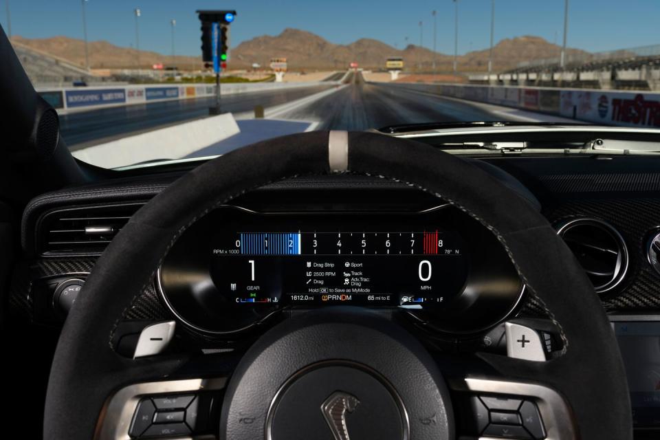 <p>A 12.0-inch digital instrument cluster and a steering wheel wrapped in leather and Alcantara are standard on all GT500s.</p>