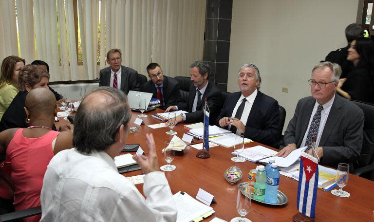 European chief negotiator Christian Leffler (R) and Cuban Deputy Foreign Minister Abelardo Moreno (L, foreground) at a meeting in Havana on March 4, 2015