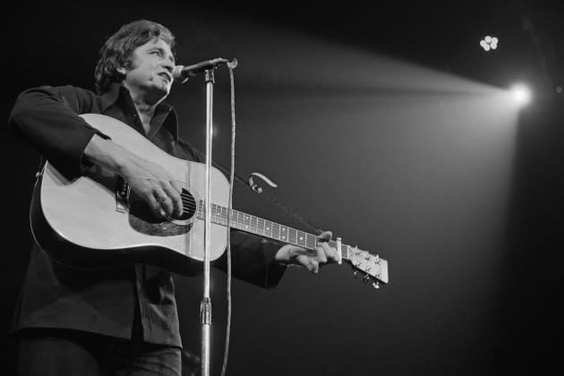 Johnny Cash On Stage - Credit: Michael Putland/Hutton Archive/Getty Images