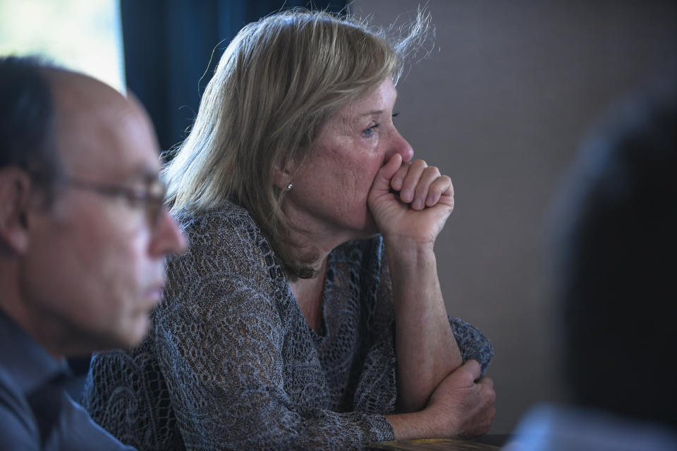 Bobbie Ziff, center, David Horn, left, and others listen to the stories people shared at a gathering for families of Holocaust survivors, Sunday, Sept. 26, 2021, in East Brunswick, N.J. Her father built a new life in America and owned a luncheonette in Brooklyn, New York. He never talked about the Holocaust, but he often had nightmares and screamed in his sleep, Ziff says. (AP Photo/Brittainy Newman)