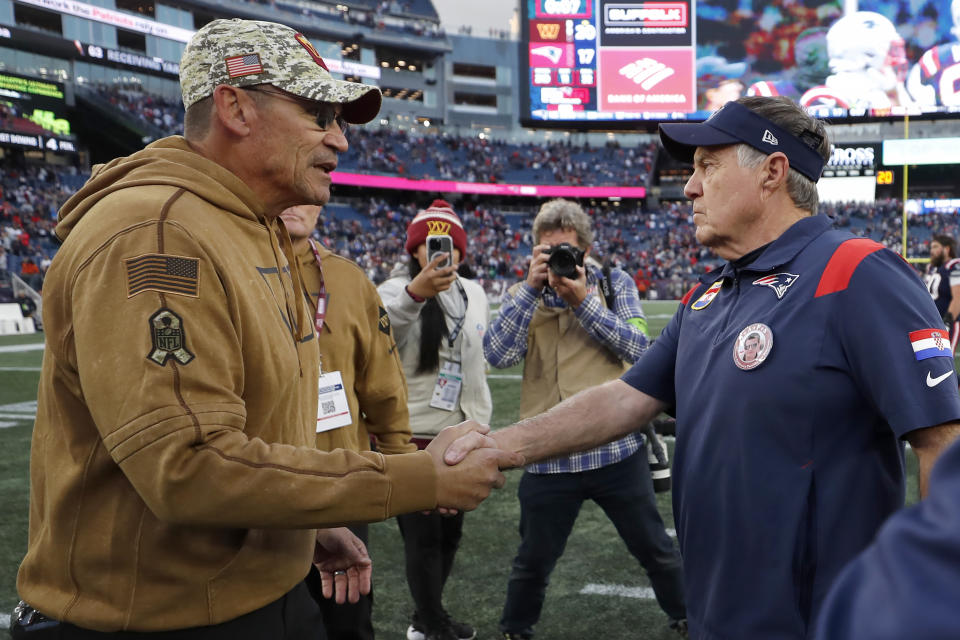 Washington Commanders head coach Ron Rivera, left, shakes hands with New England Patriots head coach Bill Belichick, right, following an NFL football game, Sunday, Nov. 5, 2023, in Foxborough, Mass. (AP Photo/Michael Dwyer)