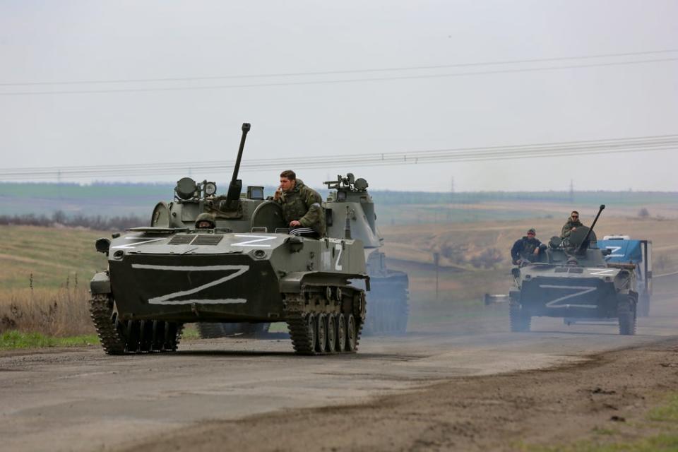 Russian military vehicles move on a road in an area controlled by Moscow-backed separatist forces near Mariupol (AP)