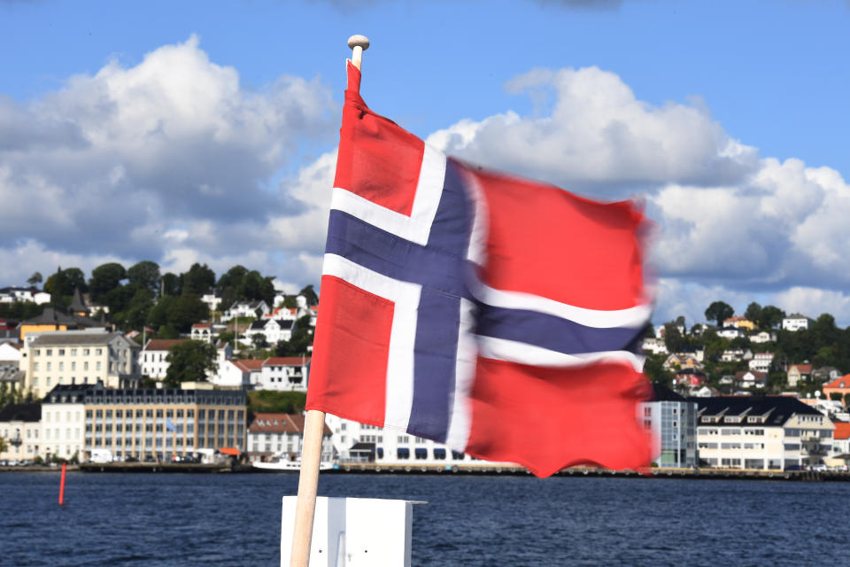 Norwegian flag in the Sogne harbour, southern Norway. Photo: Getty