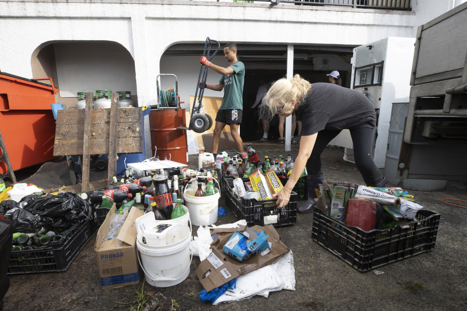 Restaurant owner Sarah Newson, right, cleans the flood damage at her restaurant in Auckland, New Zealand, Sunday, Jan. 29, 2023. A dangerous amount of rain is forecast Tuesday for New Zealand’s most populous city four days after Auckland had its wettest day on record in a storm that claimed four lives. (Brett Phibbs/New Zealand Herald via AP)