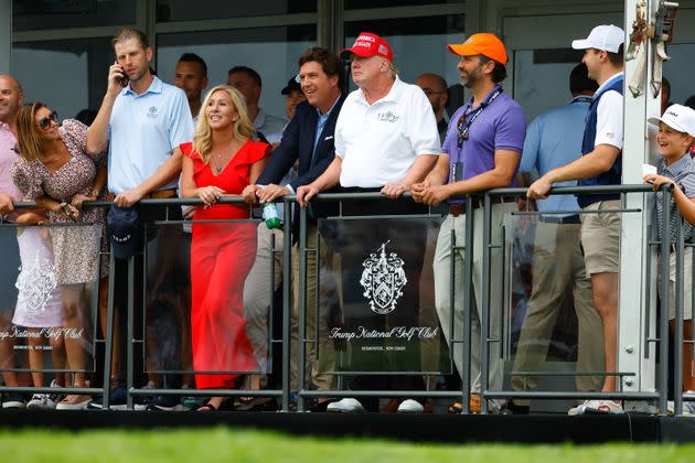 Tucker Carlson — pictured center next to Donald Trump, got support from Marjorie Taylor Greene and Donald Trump Jr. (right) — in his beef with Rep. Tom Emmer. (Photo: Icon Sportswire via Getty Images)