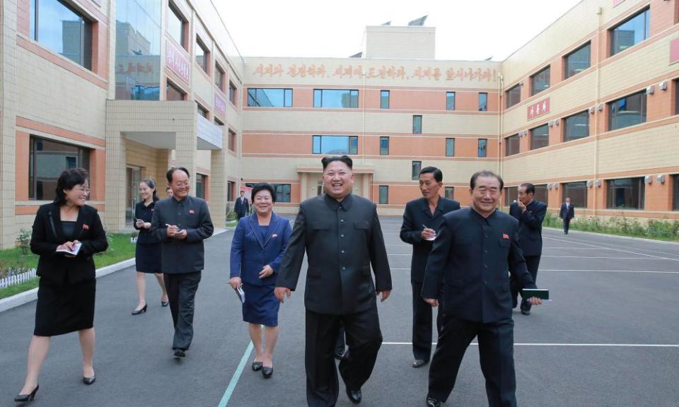 North Korean leader Kim Jong-Un visits a shoe factory