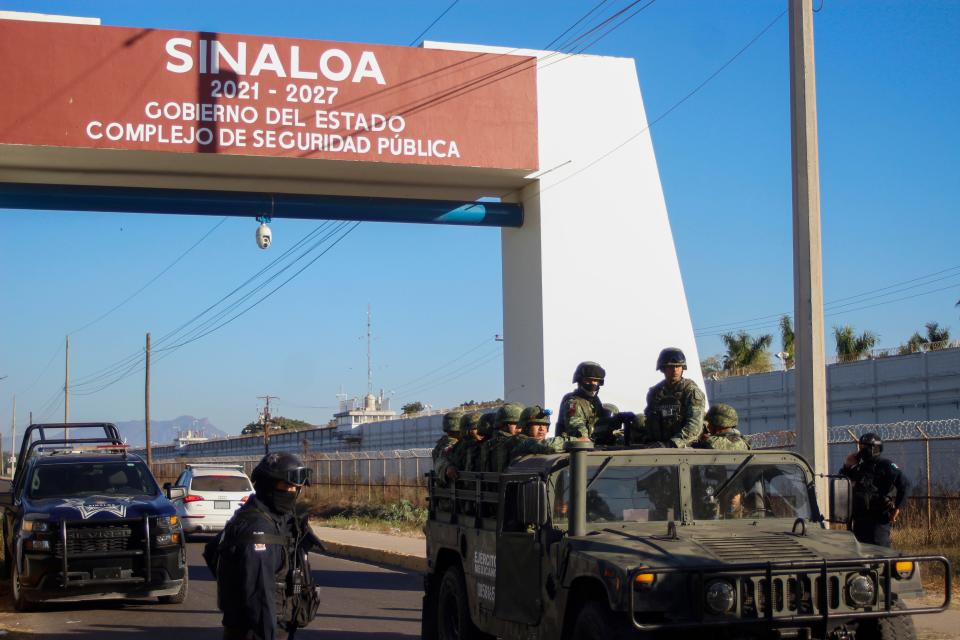 Police and military patrol Culiacan, Sinaloa state, Mexico, Friday, Jan. 6, 2023. The government operation on Thursday to detain Ovidio Guzman, the son of imprisoned drug lord Joaquin “El Chapo” Guzman, unleashed firefights that killed 10 military personnel and 19 suspected members of the Sinaloa drug cartel, according to authorities. (AP Photo/Martin Urista)