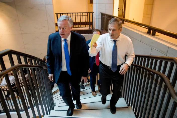 Rep. Mark Meadows, R-N.C., left, and Rep. Jim Jordan, R-Ohio, leave a closed door meeting on Capitol Hill in Washington in 2019.