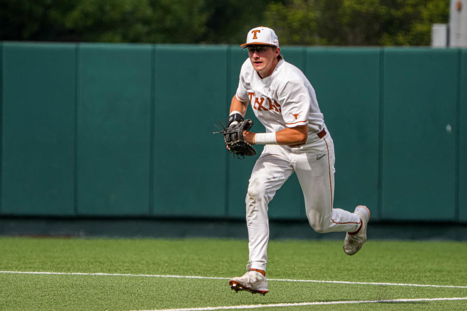 Texas infielder Jared Thomas runs the ball to first base during the game against West Virginia at UFCU Disch-Falk Field last season.