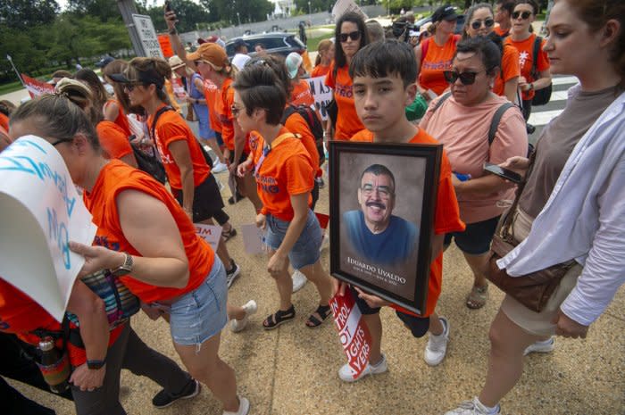 A participant of the March Fourth rally to ban assault weapons holds a sign for Eduardo Uvaldo, a victim of the Highland Park shooting, outside the Senate office buildings at the U.S. Capitol in Washington, D.C., on July 13, 2022. File Photo by Bonnie Cash/UPI