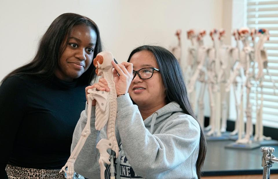 Jordyn Williams and Amanda Vergel in the Academy of Scientific Inquiry and Medicine biomed class at Mainland High School, Tuesday, Feb. 14, 2022.