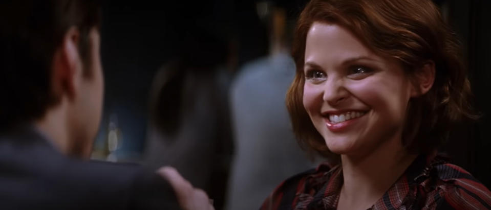 Ginnifer Goodwin smiles brightly at a man in the scene from the movie "He's Just Not That Into You"