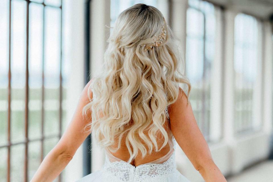 <p>Getty</p> Bride showcasing her wedding hairstyle