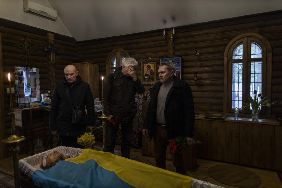 Relatives and friends mourn Anatoly Morozov, 55, a member of a Ukrainian territorial defense unit, in Kyiv.