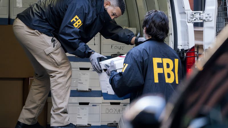 Federal agents load a vehicle with evidence boxes taken from a property related to Russian oligarch Oleg Deripaska on Oct. 19, 2021, in New York.