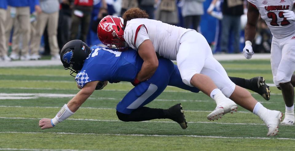 Louisville’s  Ashton Gillotte sacks Kentucky’s Will Levis.Nov. 26, 2022