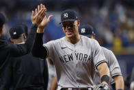 New York Yankees' Aaron Judge celebrates with teammates after the team's win over the Tampa Bay Rays in a baseball game Friday, May 27, 2022, in St. Petersburg, Fla. (AP Photo/Scott Audette)