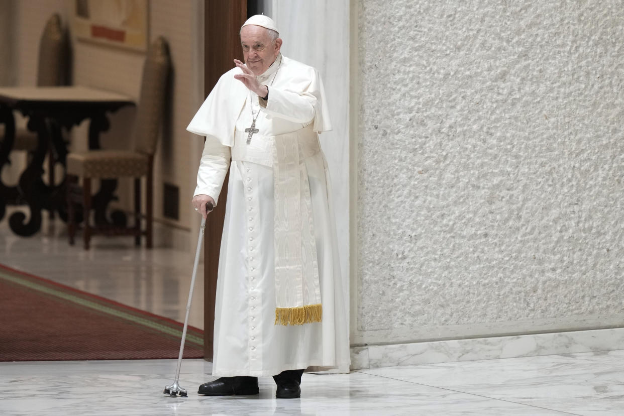 Pope Francis waves to faithful as he arrives in the Paul VI hall for his the weekly general audience at the Vatican, Wednesday, Aug. 10, 2022. (AP Photo/Andrew Medichini)