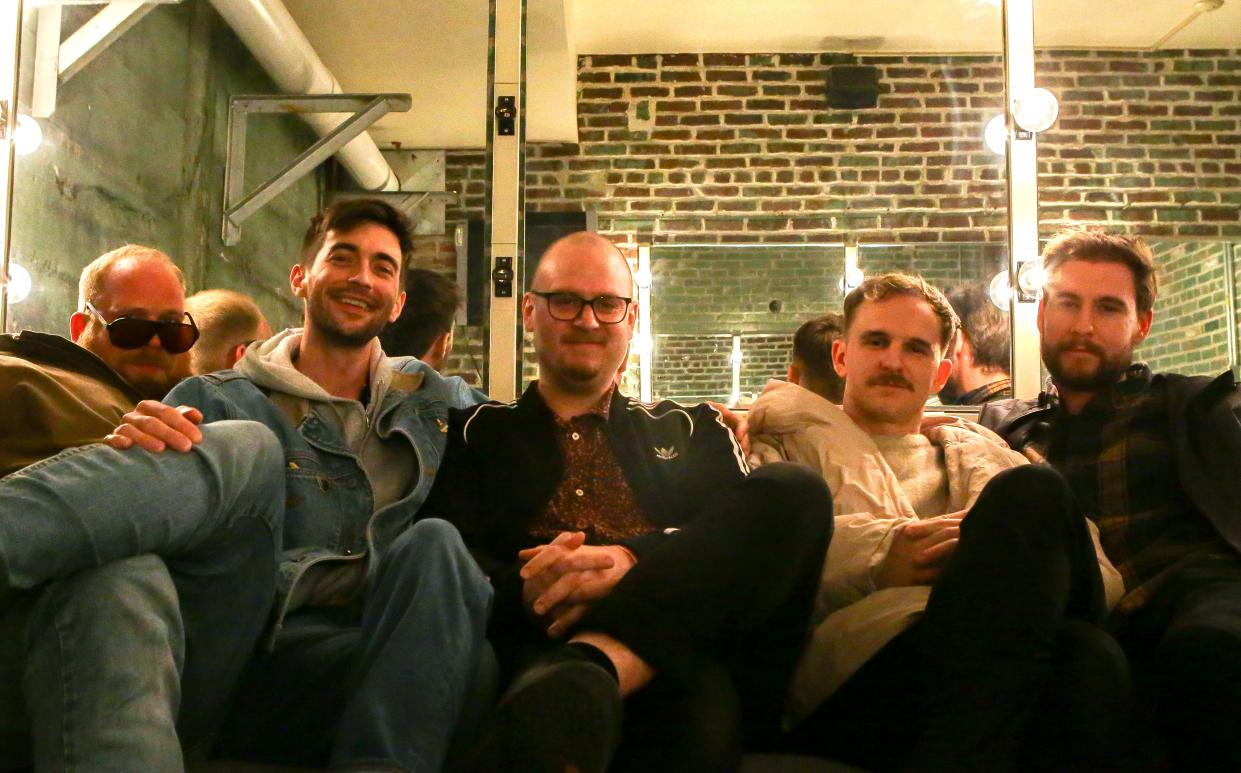 Halfloves, featuring, from left, Zach Ziemer, Jeff Roalson, Lucas Adolphson, Trevor Polk and Nate Cooper pose prior to their performance at the Englert Theatre's second local showcase Saturday, Feb. 10, 2024 in Downtown Iowa City.