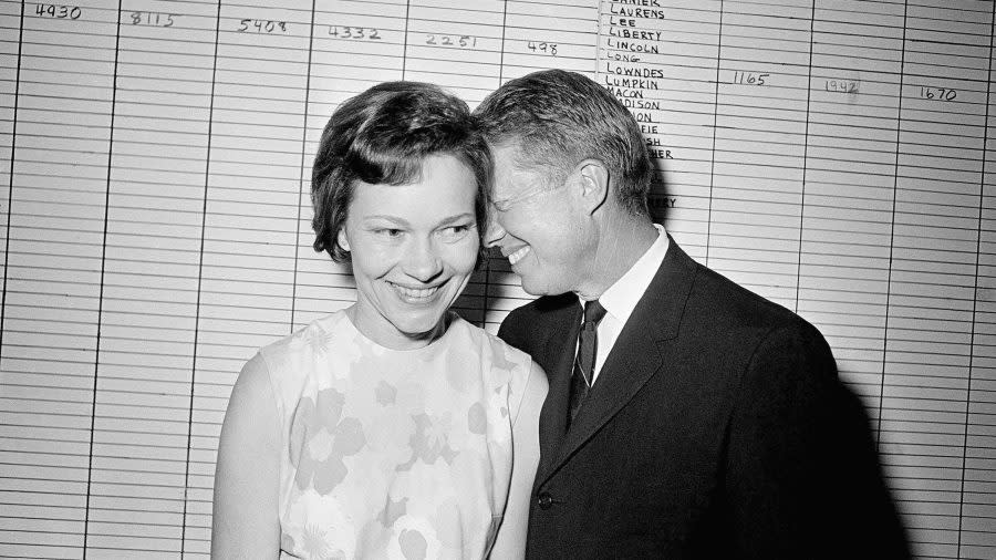 In this Sept. 15, 1966, file photo, then Georgia State Sen. Jimmy Carter hugs his wife, Rosalynn, at his Atlanta campaign headquarters. Rosalynn Carter turns 96 on Friday, Aug. 18, 2023 and is celebrating at home in Plains, Ga., with her family, including former President Jimmy Carter. Her plan includes eating cupcakes and peanut butter ice cream, then releasing butterflies in her garden — with friends doing the same around the Carters’ hometown. (AP Photo/File)