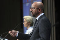 European Council President Charles Michel talks during an online press conference with European Commission President Ursula von der Leyen, background, and German Chancellor Angela Merkel following an EU-China virtual summit at the European Council building in Brussels, Monday, Sept. 14, 2020. Michel, Merkel and Von der Leyen had talks in a videoconference with China's President Xi Jinping. (Yves Herman/Pool Photo via AP)