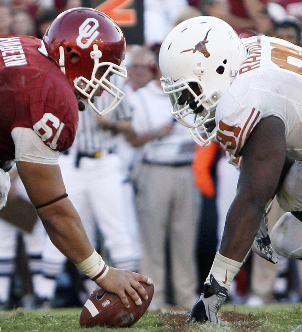 FILE - In this Oct. 2, 2010, file photo, Texas defensive tackle Kheeston Randall (91) and Oklahoma offensive lineman Ben Habern (61) face off at the line of scrimmage during an NCAA college football game at the Cotton Bowl in Dallas. No. 5 Oklahoma and No. 9 Texas are playing in a rare Red River rivalry rematch in the Big 12 championship game on Saturday. It is the first time in 115 years that the border state rivals will play twice in the same season. (AP Photo/LM Otero, File)