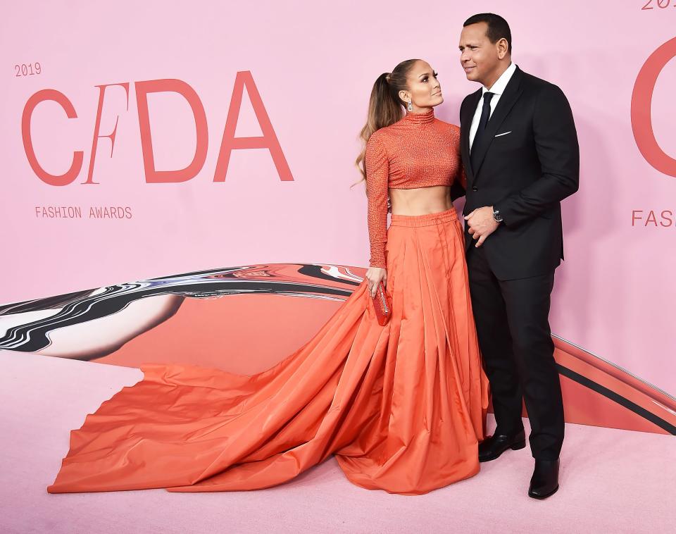 Is there anything J. Lo <em>hasn't</em> won an award for? The multi-hyphenate entertainer was <a href="https://people.com/style/cfda-2019-jennifer-lopez-fashion-icon-award/" rel="nofollow noopener" target="_blank" data-ylk="slk:honored with the Fashion Icon Award;elm:context_link;itc:0;sec:content-canvas" class="link ">honored with the Fashion Icon Award</a> at the Council of Fashion Designers of America (CFDA) Awards in June 2019, and naturally showed up dressed to impress (and to make us wonder how many crunches we'd need to do to get abs like that). Understandably, her proud fiancé couldn't take his eyes off her either. "The 🔥 of my 👁," he wrote on <a href="https://www.instagram.com/arod/?utm_source=ig_embed" rel="nofollow noopener" target="_blank" data-ylk="slk:Instagram;elm:context_link;itc:0;sec:content-canvas" class="link ">Instagram</a>. "There are icons…but there is only one Jennifer Lopez, ladies and gentlemen. <span>#CFDA."</span>