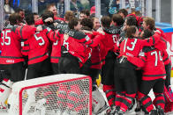 Canada celebrates its victory over Germany during the gold medal match at the Ice Hockey World Championship in Tampere, Finland, Sunday, May 28, 2023. Canada won 5-2. (AP Photo/Pavel Golovkin)